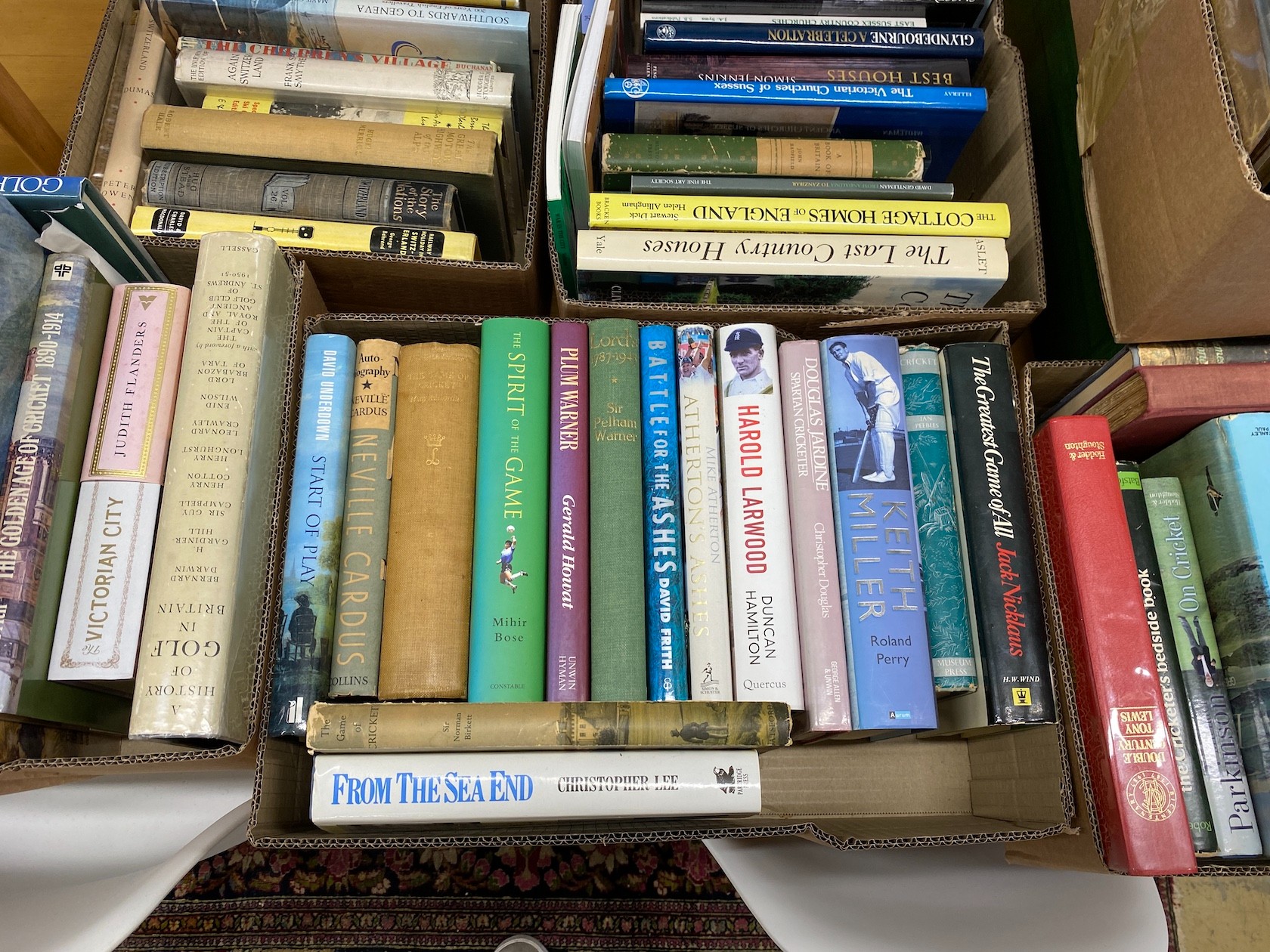 Seven boxes of assorted books, sporting history, English architecture and fine art related